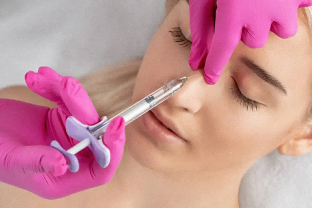 girl getting nasal filler treatment