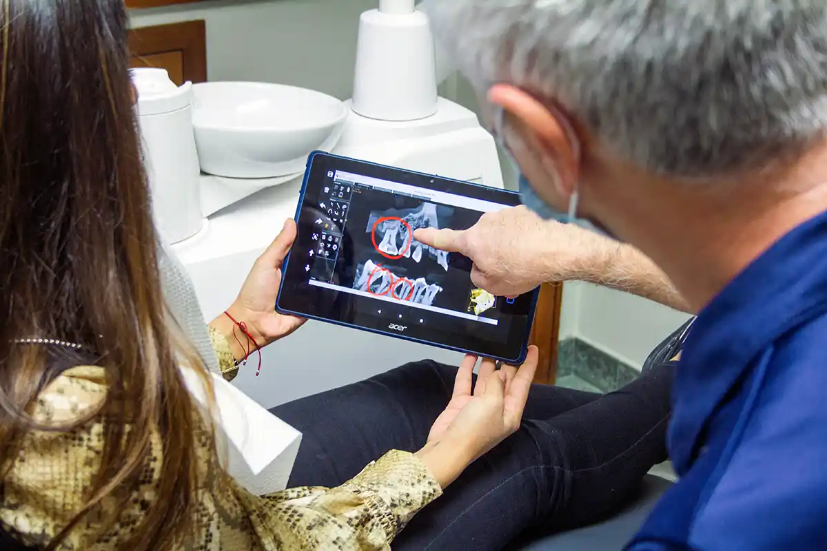 dentist checking xray for wisdom theeth removal