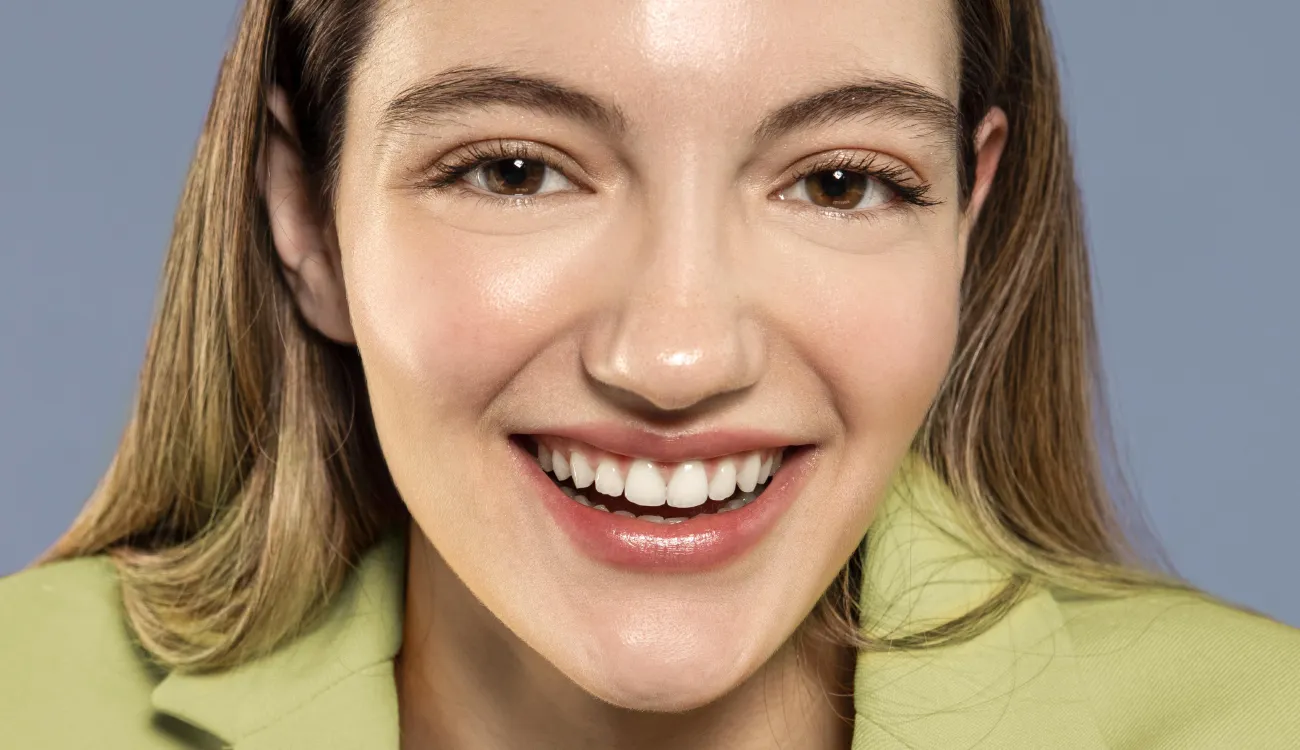 HAPPY PETIENT AFTER SUCCESSFUL DENTAL IMPLANT